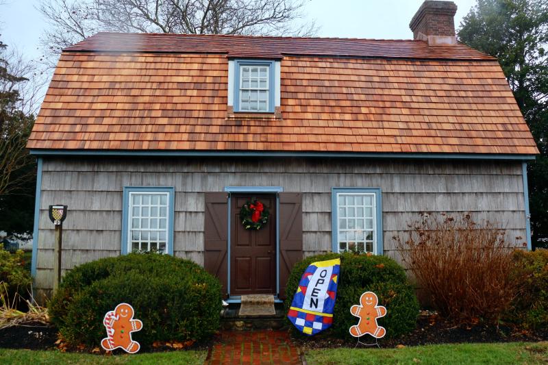 The brand-new roof atop the Maull House held up strong in the rain, seeming to shine with a coat of water running down it.