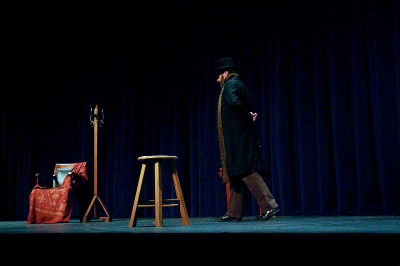 Gerald Dickens walks on stage as Ebenezer Scrooge, a squeezing, wrenching, grasping, scraping, clutching, covetous, old sinner!