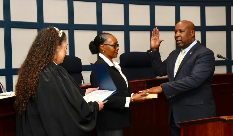 Sussex County Register of Wills Greg Fuller, right, accompanied by his wife, Esther, is sworn in by Kent Superior Court Judge Reneta Green-Streett.