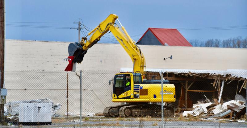 DAY 1. A demolition crew begins to tear down the garden center on the eastern side of the former Bests’ Ace Hardware store.