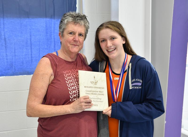 Sussex Academy Aquatics Director Lydia Schmierer presents the Championship Meet Vince Morris Award for the outstanding girls’ performer to Sussex Academy’s Gracie Maughan.