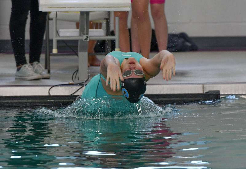 Cape’s Jenna Reinhold leaves the blocks in the medley relay. She also placed fourth in the 100 backstroke in 1:05.84.