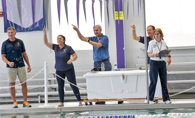 Cheering on their team are Cape coaches (l-r) Bill Geppert, Colleen Bailey, Pete Olson and Rick Brokaw.