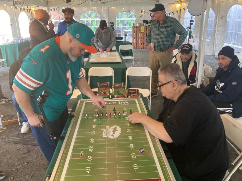 Jimbo Dunagan, left, and Jim “The Hulk” Davis square off in the championship match of the Electric Football World Championships held at Dogfish Head in Milton Feb. 5. The three-day tournament brought electric football coaches from all over the country, with Davis, a native of Detroit, taking home the title with a 9-0 victory. RYAN MAVITY PHOTOS