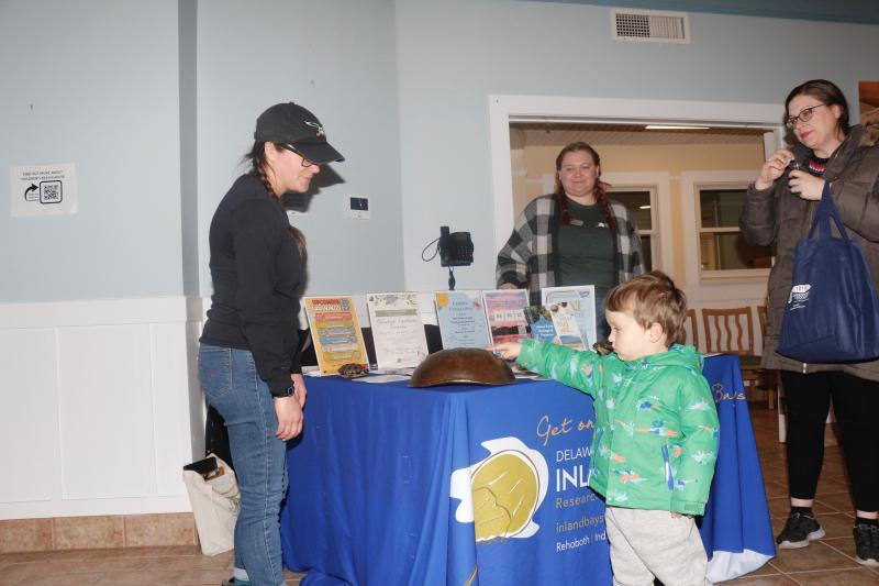 Delaware Center for the Inland Bays had the shells of a turtle and a horseshoe crab at its table. Shown are (l-r) Jackie Knoll, Maddie Fox, Oliver Stewart and Jennifer Stewart.