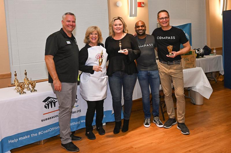 Sussex Habitat CEO Kevin Gilmore (l-r) presents the awards for the favorite appetizers. Shown are Brigit Taylor, first place; Margaret Poisson, second place; and Jason Mathis and Chris Beagle, third place.