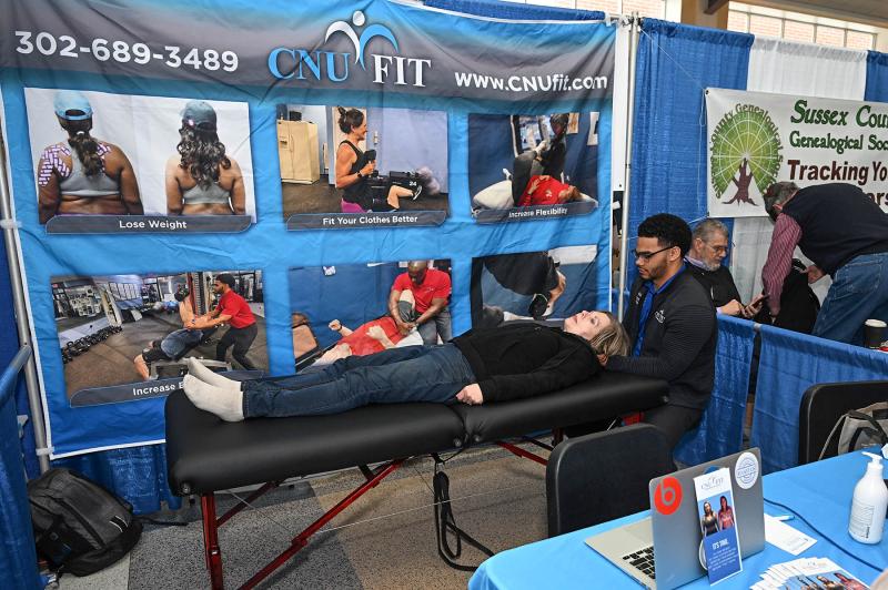 Jordan Amdrell from CNU Fit gives a treatment to Vera Sitze during the event. For more information, go to cnufit.com.