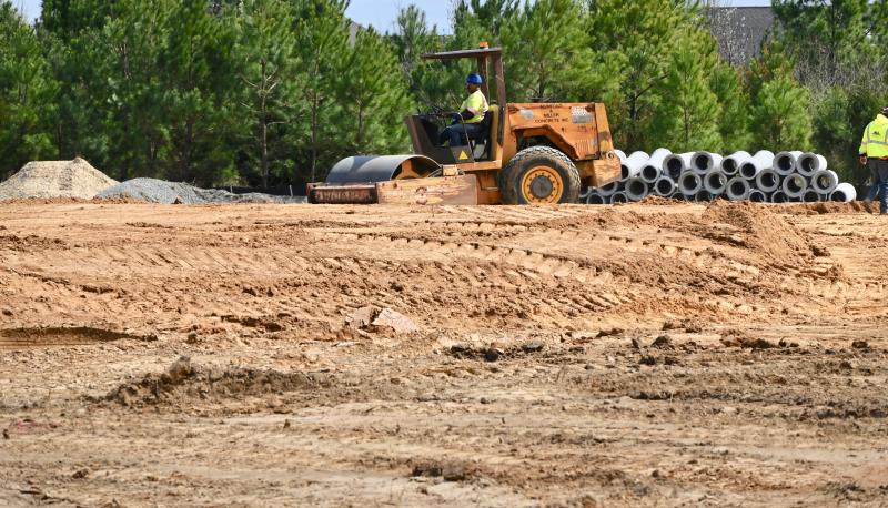 Tons and tons of dirt is being moved around the site of a new traffic roundabout planned at the Plantation Road-Beaver Dam Road intersection. RON MACARTHUR PHOTO