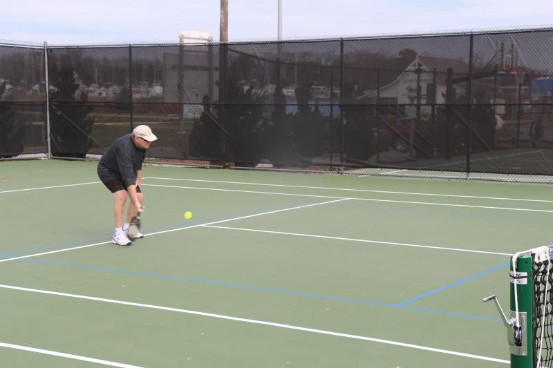 Tim Bane had knee surgery in 2017, and he now has concerns about the amount of traction on the new court surface and the adjustments needed to reach lower than usual to strike a ball.