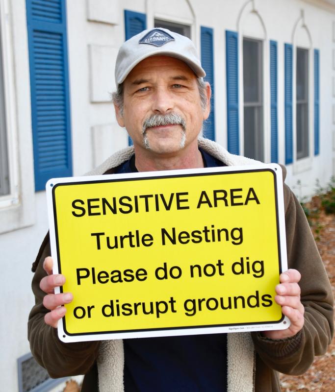 Winding Creek Village resident Dan Phillips says posting this sign at the parcel in question would go a long way toward protecting terrapin nesting sites in the community.