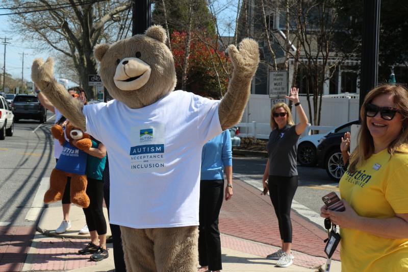 Soliciting honks from drivers along Rehoboth Avenue, Alex the Autism Delaware Bear and his cohorts try to get the public to take a second to think about autistic Delaware public school students.