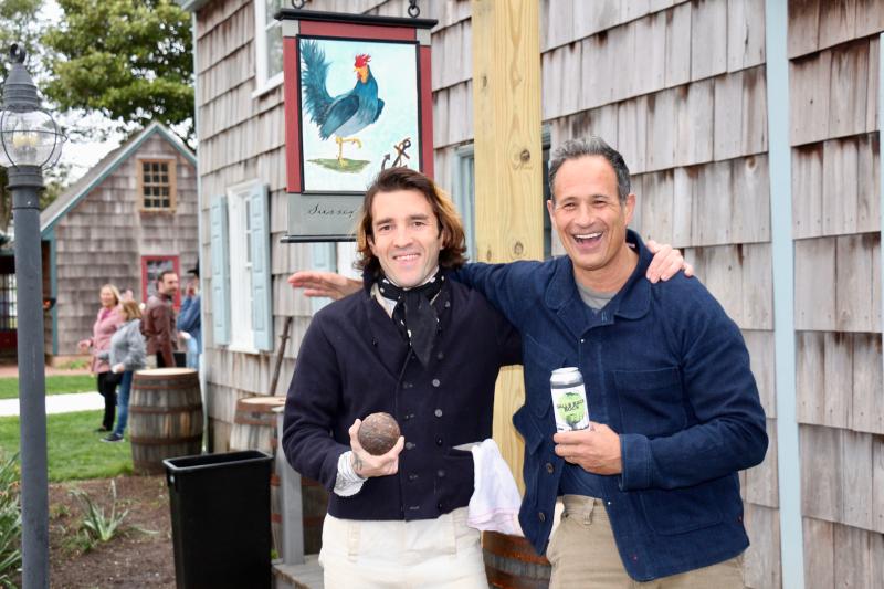 Lewes Historical Society Executive Director Andrew Lyter and Dogfish Head founder Sam Calagione have a ball with the guest of honor and its namesake brew. AARON MUSHRUSH PHOTO