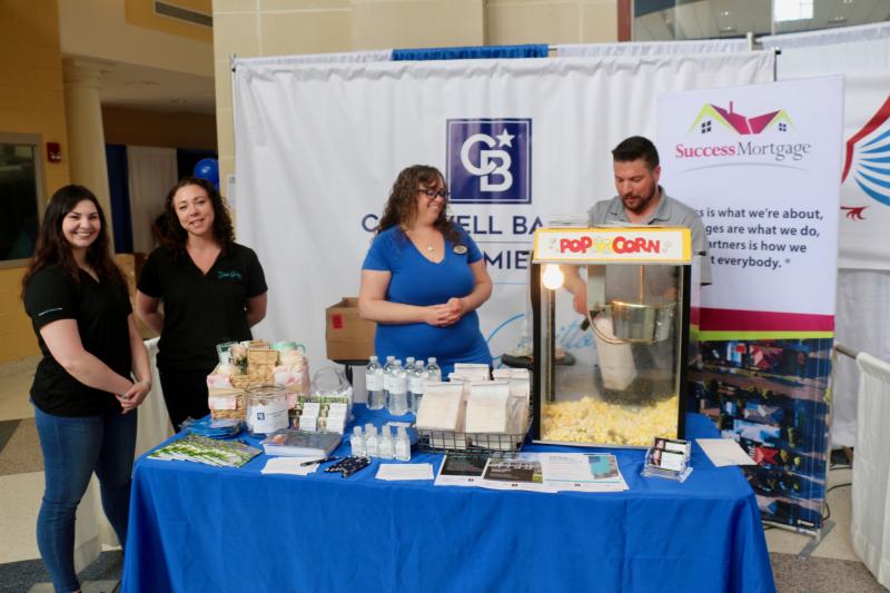 The Julie Gritton Team at Coldwell Banker and Success Mortgage makes sure folks have popcorn before entering the show. Shown are (l-r) Emily Vando, Christina Bourdosis, Robin Ackerman and Matt Haberlie.