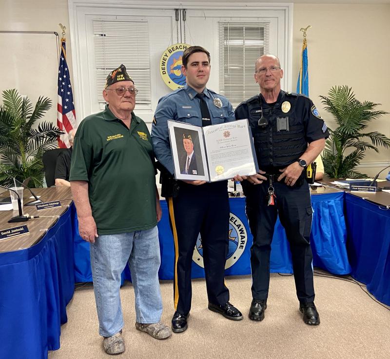Dewey Beach Patrolman First Class Jack Kane is presented with the VFW National Law Enforcement Award by Milton VFW Post 6984 Quartermaster Bob Maclees, left, and Post 6984 member and Fenwick Island Cpl. Chris Story. Kane also received the Milton VFW Post 6984 Officer of the Year Award. ELLEN DRISCOLL PHOTOS
