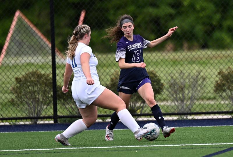 Sussex Academy’s Sienna Serpico battles on the sideline with Caesar Rodney’s McKenzie Downs.