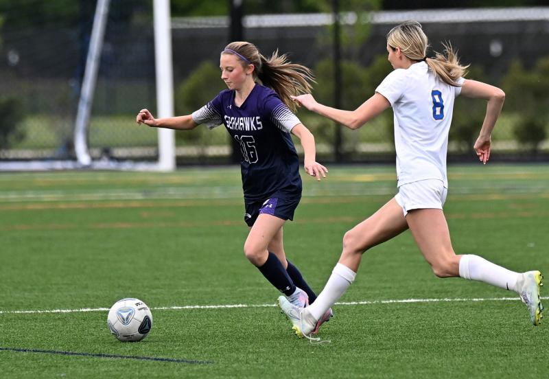Seahawks eighth-grader Riley Moriarty speeds the ball away from CR’s Kate Benson.