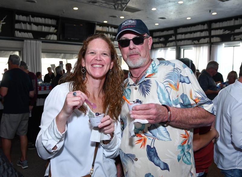 Enjoying the event are (l-r) Meghan McCalley of the Rehoboth Beach-Dewey Beach Chamber of Commerce, left, and Ernie Hyett of Hyett Refrigeration Inc.