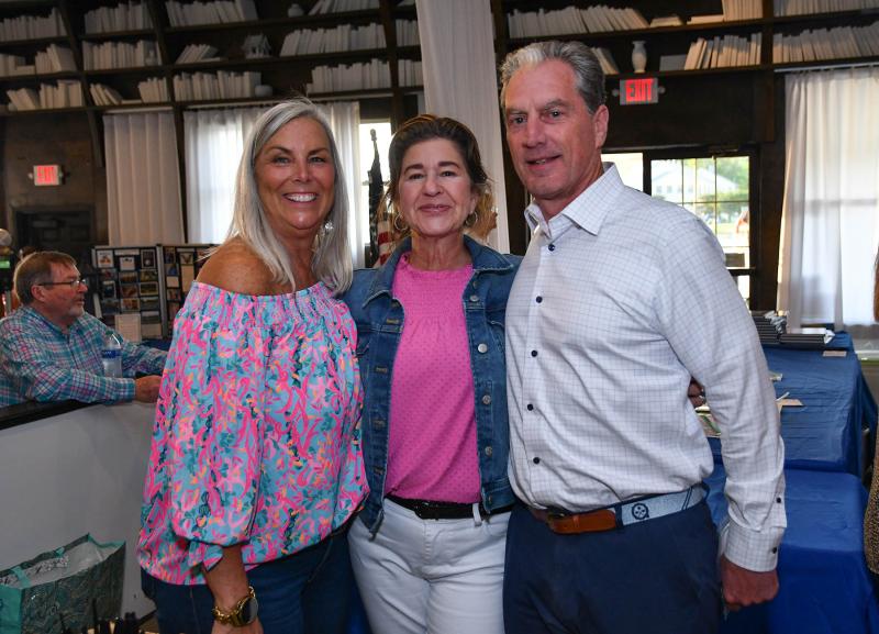Posing for a picture are Ivy Manager Brooke Sterling, left, and Leslie and Billy Savage of Diamond State Meats.