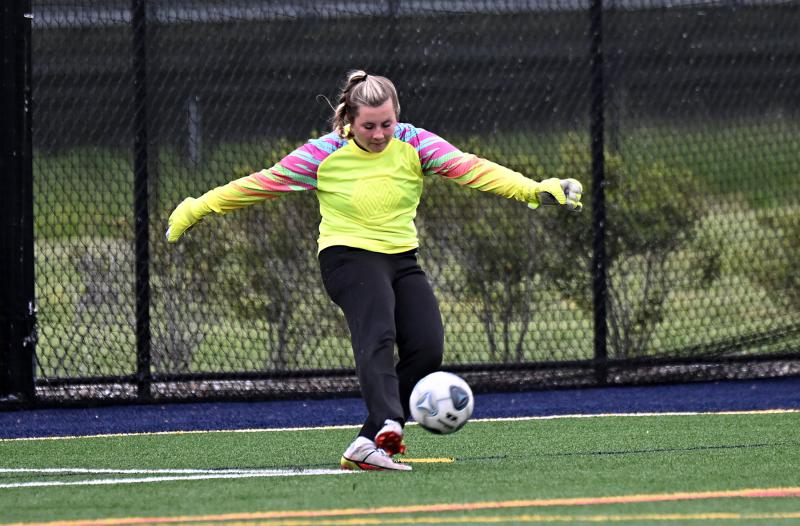 Sussex Academy junior keeper Grace Fiorilla clears the ball after a save.