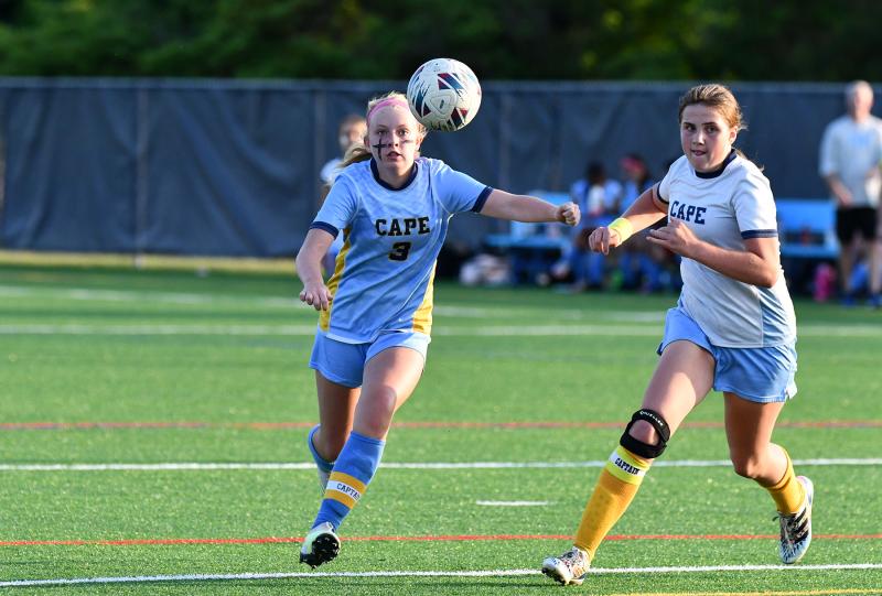 Beacon captain Ellie Sprague, left, moves the ball into the Mariner defensive zone as Sadie Wakefield gives chase.