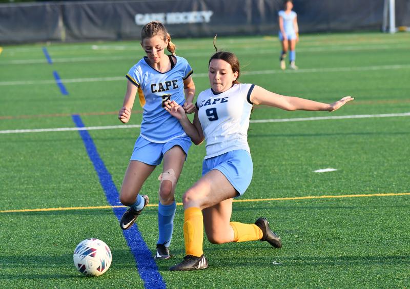 Mariner’s Vanessa Cooper boots the ball away from Beacon’s Lindsay Hassell.