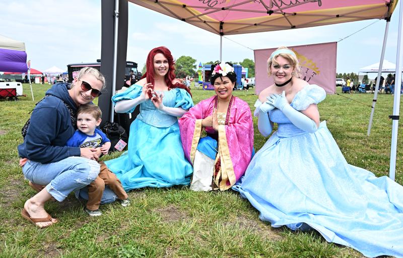 Harper Winkey, 3, meets his favorite characters. Shown are (l-r) Linsey Webb, Winkey, Ariel, Mulan and Cinderella. The characters are from Pursuit for Peace, which serves the community as a woman-owned, multi-state 501(c)3 by bringing joy to those who need it most, particularly to children facing devastating trauma due to severe medical conditions and circumstances.