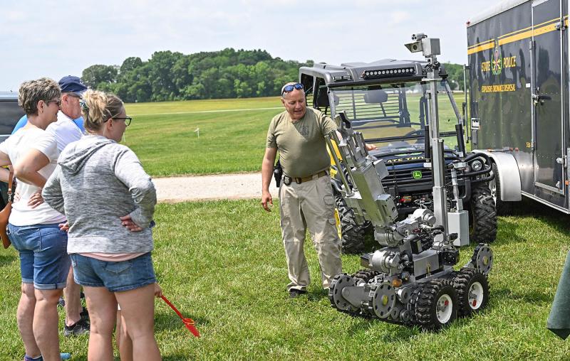 Cpl. Brian Crisman of the Delaware State Police Bomb Squad displays the robotic officer used to dispose of threats.
