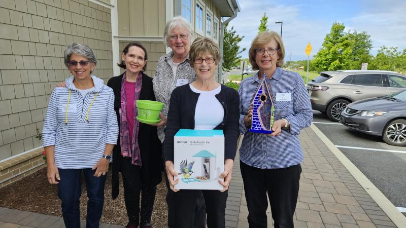 Lewes in Bloom garden market committee members holding sale items are (l-r) Diane McGreal, board of advisors liaison; Maureen Ciano; Eileen Larkin; Carol Dunnington, garden market committee chair; and Sue Sandmeyer, who made the mosaic birdhouse to be raffled. Not pictured Is Cecilia Friend. SUBMITTED PHOTOS