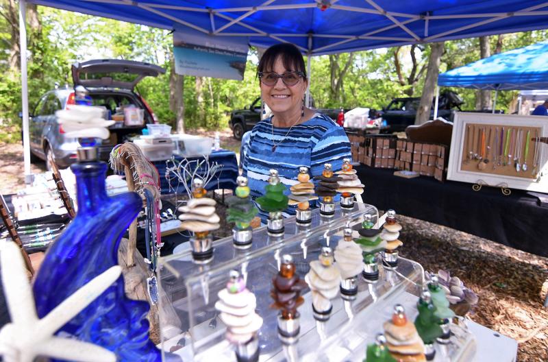 Paulette Hardy of Blue Moon Sea Glass shows off her beautiful wine stoppers made from unique beach finds.