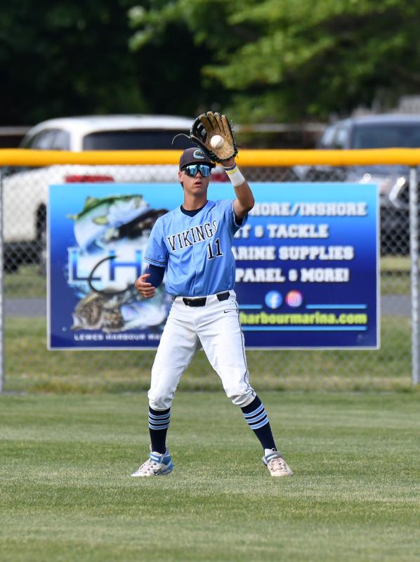 Cape center fielder Barritt Ross snags a fly ball in left center.