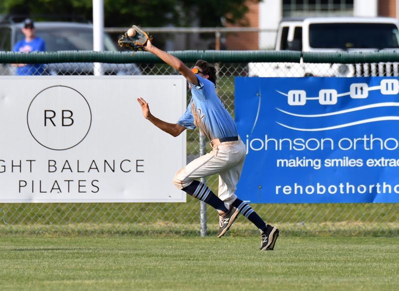 Trey Hitchcock runs down a fly ball in the outfield.