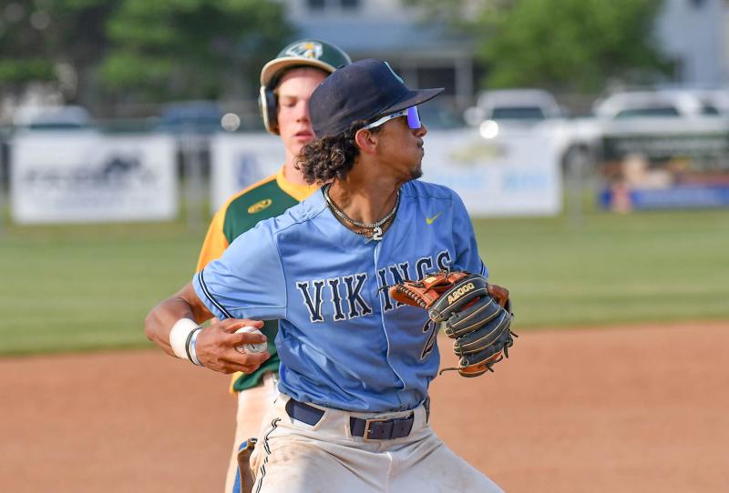 Cape third baseman Lex Wescott throws to first for an out.