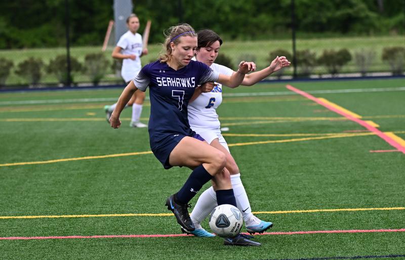 Sussex Academy junior Tayler Flaherty controls play in the midfield from Riders senior Anastasia Kill in the 3-2 victory. DAN COOK PHOTOS