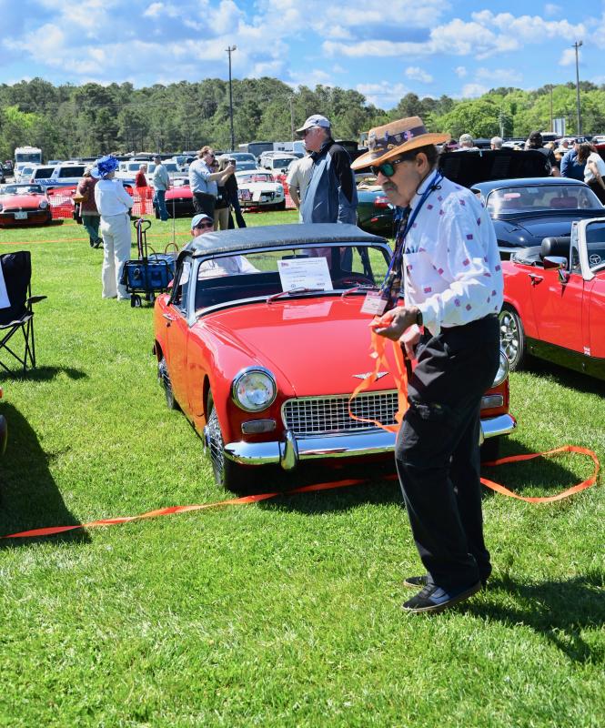 Car show Chair Mike Tyler checks out the cars on display at the Lewes ferry terminal.