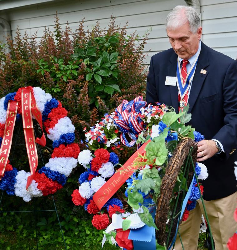 Dennis Schrader, Delaware Society Sons of the American Revolution president, lays a wreath during the ceremony.