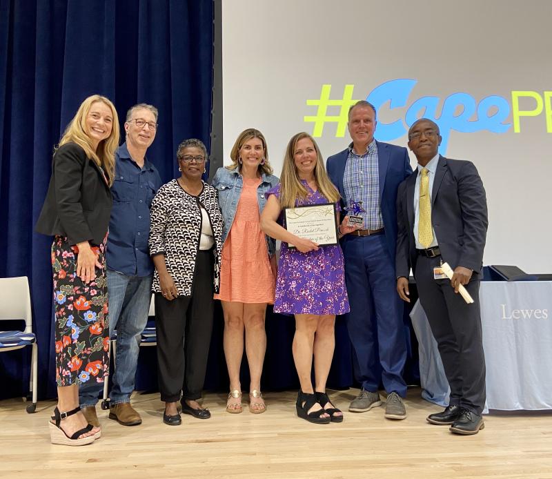Cape High chemistry teacher Rachel Peacock was named the 2024 Cape Henlopen School District Teacher of the Year May 17. Gathered are Assistant Superintendent Jenny Nauman, board member Jason Bradley, board member Janet Maull-Martin, board member Jessica Tyndall, Peacock, Superintendent Bob Fulton and 2023 Cape Teacher of the Year Rony Flechier. ELLEN DRISCOLL PHOTO
