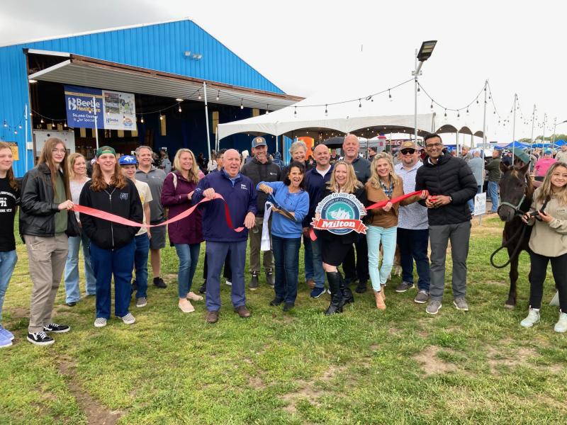 Cutting the ribbon on the new season are (l-r) Eben Cooney, Chana Fitzkee, Drew Fitzkee, Noah Gibney, Darren Shaffer, Anne Brown, Bonnie Hall, Tom Protack, Patrick Staggs, Kyle Shaffer, Kay Young, Scott Thomas, Karen Falk, Brian Grawehr, Karen Sposato, Kevin Thompson and Stump, Nitan Soni and Brianna Sealand with Charlie. RYAN MAVITY PHOTOS