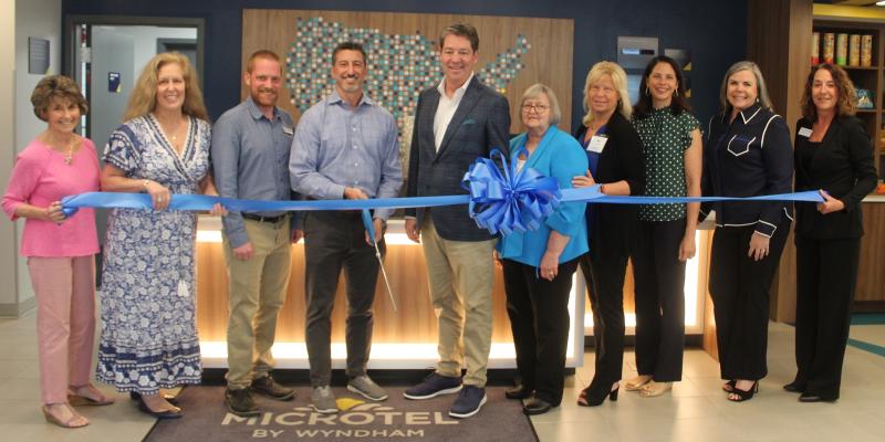Microtel Inn & Suites by Wyndham ribbon-cutting attendees shown are (l-r) Carol Everhart, Rehoboth-Dewey chamber president and CEO; Mary Susan Jones, Beacon Hospitality director of sales and revenue; Will Finerty, general manager; Ernie Felici Jr., Beacon Hospitality COO; Chad Moore, Beacon Hospitality founder; Karen J. Brown, Beacon Hospitality CFO; Keri Putera Wyndham Hotels & Resorts – Microtel Inn & Suites by Wyndham brand leader; Annabelle Petriella, Beacon Hospitality design, construction and procurement; Elyse Moore, Beacon Hospitality community relations and social media; and Kelly Stevenson, Shore United Bank. SUBMITTED PHOTO