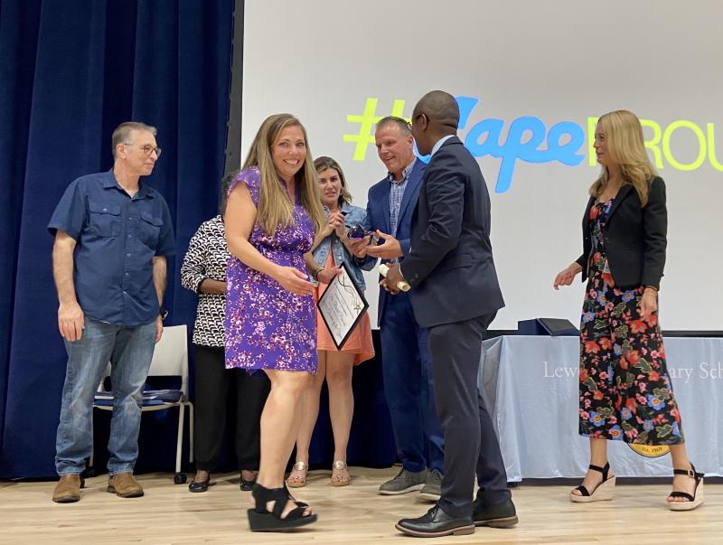 Cape High chemistry teacher Rachel Peacock is all smiles and surrounded by school, board and district officials after being named Teacher of the Year May 17.