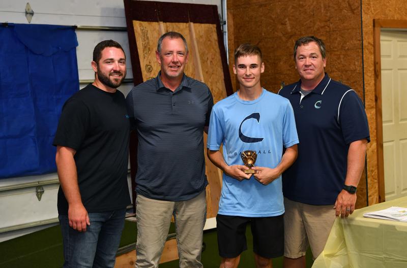 The junior varsity Offensive MVP was presented to Malachi Woods. Shown are (l-r) assistant coach Seth Brosius, assistant coach Drew Johnson, head coach Ben Evick and Woods.