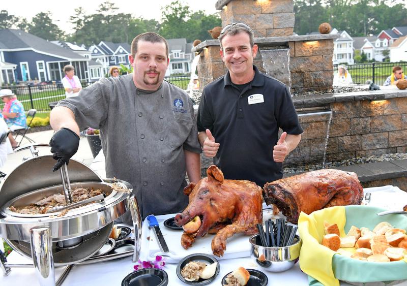 Delivering up the pork are Lodge Director of Culinary Services Billy Blakeney, right, and his assistant Kyle Brown.