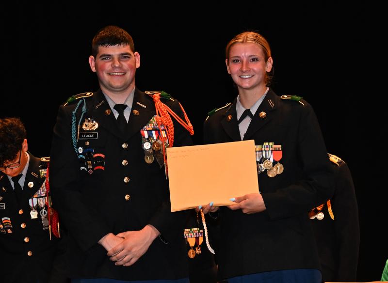 Grace Wiggins, right, receives the Military Order of the Purple Heart from Cadet Battalion Commander Isaac League.
