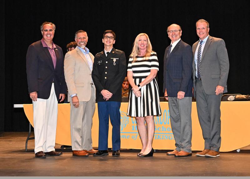 Tyler Haun earned the title of 2022-23 Cadet of the Year. Shown are (l-r) former Sen. Ernie Lopez, former Rep. Steve Smyk, Haun, Cape Principal Kristin DeGregory, Rep. Jeffrey Hilovsky and Cape Superintendent Bob Fulton.