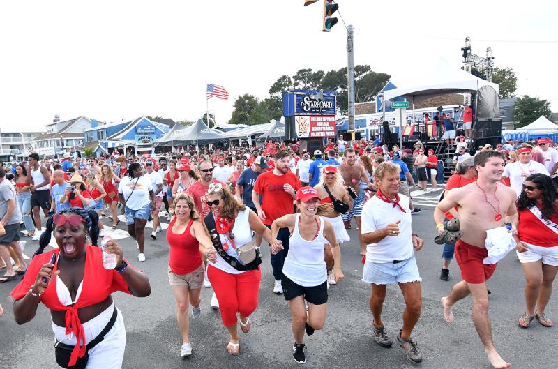 The crowd crosses Route 1 to the annual Dewey Beach Running of the Bull festivities at The Starboard.