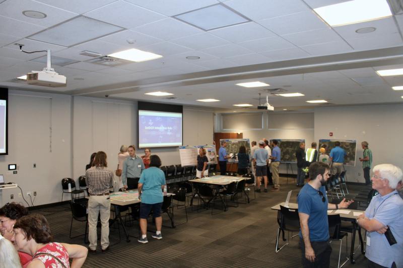 The interactive workshop had stations dedicated to different topics regarding transportation and biking. Attendees engaged in conversation with officials about the various topics.