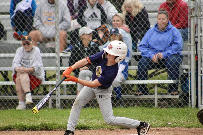 Milton 8-10 Pat Knight player Nole Beam reaches down and connects with a low pitch to jump-start the Milton offense. AARON MUSHRUSH PHOTO
