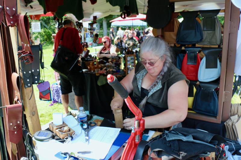 Elizabeth Lehman, the owner of Emporer’s Needle Leather, is hard at work crafting various leather items for a variety of needs. Her items can be seen at emporersneedle.wordpress.com. AARON MUSHRUSH PHOTO