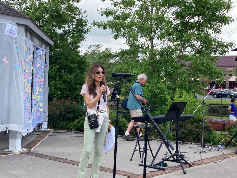 Nicole Pickles, executive director of Cancer Support Community Delaware, speaks to the crowd at Milton Memorial Park.