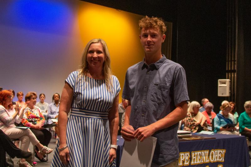 Luke Burton received the Dewey Beach Lions Club John Waples Educational Scholarship, Flagler Lacrosse Scholarship and Flagler Presidential Merit Scholarship. Shown are Principal Kristin DeGregory, left, and Burton.