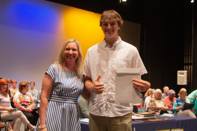 Odin DeLazaro Potemski received the Senior JROTC Dewey Beach Triathlon Appreciation Scholarship with Principal Kristin DeGregory.